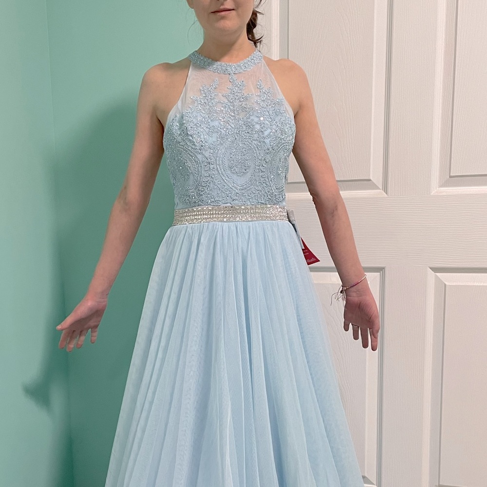 This is a beautiful gown NWT. You’ll feel like a princess in it.